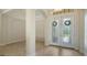 Welcoming foyer with arched entryway, columns and elegant double front doors at 6931 Brier Creek Ct, Lakewood Ranch, FL 34202