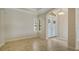 Entryway with front doors, sidelight window and neutral tile floors at 6931 Brier Creek Ct, Lakewood Ranch, FL 34202