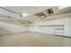 Clean and organized garage space with epoxy floor and built-in storage cabinets at 6931 Brier Creek Ct, Lakewood Ranch, FL 34202