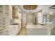 Modern kitchen boasting white cabinetry, stainless steel appliances, and a large island with a light-toned countertop at 6931 Brier Creek Ct, Lakewood Ranch, FL 34202