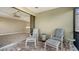 Relax on the lanai with comfortable seating and a view of the interior living space at 6931 Brier Creek Ct, Lakewood Ranch, FL 34202