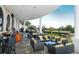 Covered outdoor patio with comfortable seating, ideal for relaxation and entertainment at 6931 Brier Creek Ct, Lakewood Ranch, FL 34202