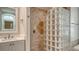Bathroom with glass block shower, vanity and decorative tilework at 6931 Brier Creek Ct, Lakewood Ranch, FL 34202