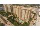 Aerial view of buildings at Renaissance at Rosemary Place overlooking pond, fountain, and pool at 750 N Tamiami Trl # 208, Sarasota, FL 34236