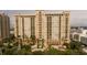 Exterior of building at Renaissance at Rosemary Place overlooking pond, fountain, and pool at 750 N Tamiami Trl # 208, Sarasota, FL 34236