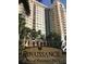 Renaissance at Rosemary Place building exterior featuring lush landscaping and a water fountain at 750 N Tamiami Trl # 208, Sarasota, FL 34236