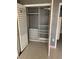 Open closet with shelving and hanging racks providing ample storage solutions at 750 N Tamiami Trl # 208, Sarasota, FL 34236