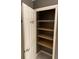 View of open closet door, showing interior shelves at 750 N Tamiami Trl # 208, Sarasota, FL 34236