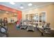 Well-equipped gym with treadmills, ellipticals, and natural light at 750 N Tamiami Trl # 208, Sarasota, FL 34236