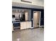 Modern kitchen showcasing wood cabinets, stainless appliances, and tile flooring at 750 N Tamiami Trl # 208, Sarasota, FL 34236