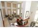 Overhead view of a grand lobby with comfortable sofas, chairs, and a fireplace at 750 N Tamiami Trl # 208, Sarasota, FL 34236