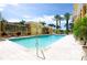 Sparkling swimming pool surrounded by palm trees and seating, perfect for a refreshing swim at 750 N Tamiami Trl # 208, Sarasota, FL 34236