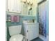 Classic bathroom featuring vintage tiles, a toilet, a sink, and a shower-tub combo at 91 39Th Street Nw Ct, Bradenton, FL 34205