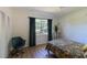 Bright bedroom with a chair, closet, and a large window offering natural light at 91 39Th Street Nw Ct, Bradenton, FL 34205