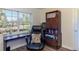 Functional home office featuring a large window, dark desk, and storage at 91 39Th Street Nw Ct, Bradenton, FL 34205
