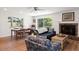 Bright living room featuring a fireplace, wood floors, and a view to the outdoor area at 91 39Th Street Nw Ct, Bradenton, FL 34205