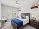 Bedroom with carpet, plantation shutters and decor at 9774 Highland Park Pl, Palmetto, FL 34221