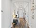 Inviting foyer with hardwood floors, a tray ceiling, and views into adjacent living spaces at 9774 Highland Park Pl, Palmetto, FL 34221
