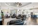 Open-concept living space featuring a modern kitchen, dining area, and comfortable seating at 9774 Highland Park Pl, Palmetto, FL 34221