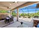 Outdoor living space featuring a patio with dining area, lounge area, and grill station at 9774 Highland Park Pl, Palmetto, FL 34221