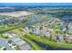 This aerial view shows the neighborhood's winding waterways and lush greenery at 11213 78Th E Ln, Parrish, FL 34219