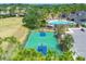 Community basketball court surrounded by trees, located near the pool and clubhouse at 11213 78Th E Ln, Parrish, FL 34219