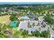 Community pool and amenities with a parking lot, sports court, and lush landscaping at 11213 78Th E Ln, Parrish, FL 34219