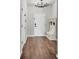 Welcoming entryway boasting stylish wood floors, a modern light fixture, and a convenient built-in bench at 11213 78Th E Ln, Parrish, FL 34219