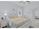 Bright bedroom features a queen-sized bed with a ceiling fan and comfortable seating at 11447 Savannah Lakes Dr, Parrish, FL 34219
