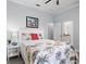Bright bedroom with a queen-sized bed, side table, and an ensuite bathroom at 11447 Savannah Lakes Dr, Parrish, FL 34219