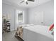 Bright bedroom with a white bed frame, ceiling fan and a built-in bookcase at 11447 Savannah Lakes Dr, Parrish, FL 34219