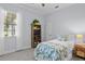 Cozy bedroom features natural light, a comfy bed, and stylish decor at 11447 Savannah Lakes Dr, Parrish, FL 34219