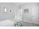 Comfortable bedroom with a cozy bed, warm lighting, and neutral walls at 11447 Savannah Lakes Dr, Parrish, FL 34219