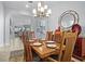 Cozy dining room featuring a classic chandelier and decor at 11447 Savannah Lakes Dr, Parrish, FL 34219