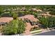 Beautiful waterfront home featuring mature landscaping, tile roof and paver driveway in a lush tropical setting at 11447 Savannah Lakes Dr, Parrish, FL 34219