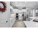 Modern kitchen featuring stainless steel appliances, white cabinetry, and center island at 11447 Savannah Lakes Dr, Parrish, FL 34219