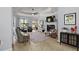 Bright living room with fireplace, ceiling fan, and neutral tones in the decor at 11447 Savannah Lakes Dr, Parrish, FL 34219
