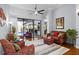 Inviting living room with large windows leading to pool area offering abundant natural light and backyard views at 11447 Savannah Lakes Dr, Parrish, FL 34219