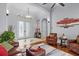 Spacious living room with decor lighting and entry door at 11447 Savannah Lakes Dr, Parrish, FL 34219