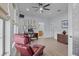 Spacious office with wood-look tile flooring, ceiling fan, and an adjacent bathroom at 11447 Savannah Lakes Dr, Parrish, FL 34219