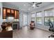 Spacious office area with natural light, wet bar and views of the water at 11447 Savannah Lakes Dr, Parrish, FL 34219