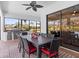Covered outdoor dining area with grill, perfect for entertaining and enjoying backyard views at 11447 Savannah Lakes Dr, Parrish, FL 34219