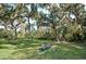 Relaxing park featuring a bench surrounded by mature trees and beautiful spanish moss at 11447 Savannah Lakes Dr, Parrish, FL 34219