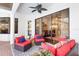 Relaxing covered patio featuring comfortable seating, accent rugs, and seamless access to the outdoors at 11447 Savannah Lakes Dr, Parrish, FL 34219