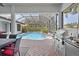 Inviting covered patio and pool area, complete with built-in grill for outdoor cooking at 11447 Savannah Lakes Dr, Parrish, FL 34219