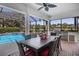 Spacious outdoor dining area overlooking the sparkling pool and lush backyard at 11447 Savannah Lakes Dr, Parrish, FL 34219