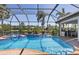 Picture of a stunning pool and patio area with a water view, perfect for outdoor relaxation at 11447 Savannah Lakes Dr, Parrish, FL 34219