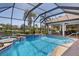 Enjoy this stunning pool and patio area with a water view, perfect for outdoor relaxation and entertaining at 11447 Savannah Lakes Dr, Parrish, FL 34219