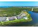 Gorgeous aerial view of homes on the water with a community pool and beautiful landscaping at 12 Tidy Island Blvd, Bradenton, FL 34210