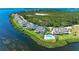 Waterfront homes and manicured lawns with community pool at 12 Tidy Island Blvd, Bradenton, FL 34210